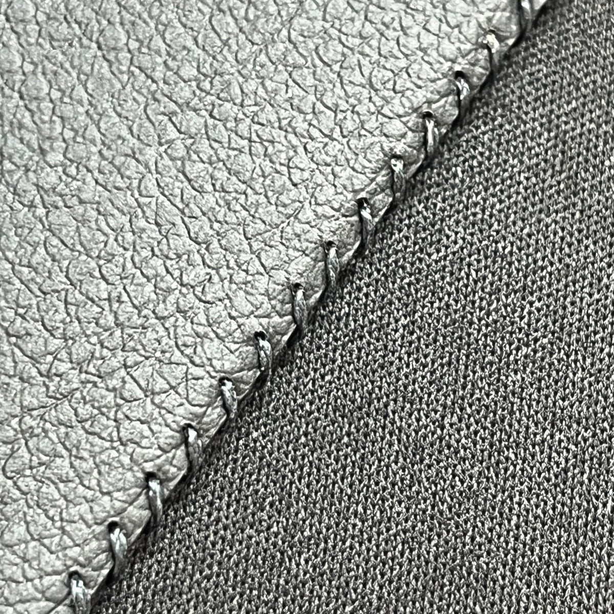 Close-up of the hand-stitched edge on the Wildcard Black Cactus Signature, Large