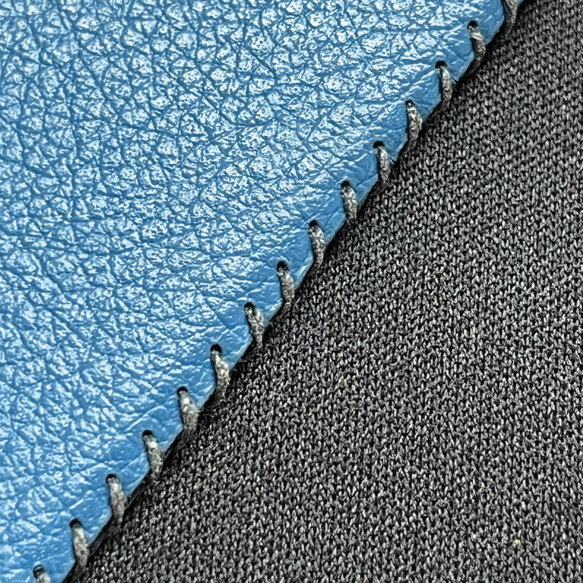Close-up of the hand-stitched edge on the Wildcard Cobalt Cactus Classic, Small