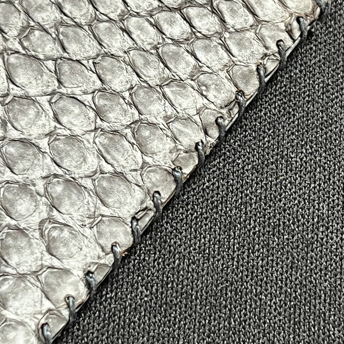 Close-up of the hand-stitched edge on a Wildcard